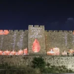 Old City Walls and Chords Bridge Shine in Honor of the Fallen